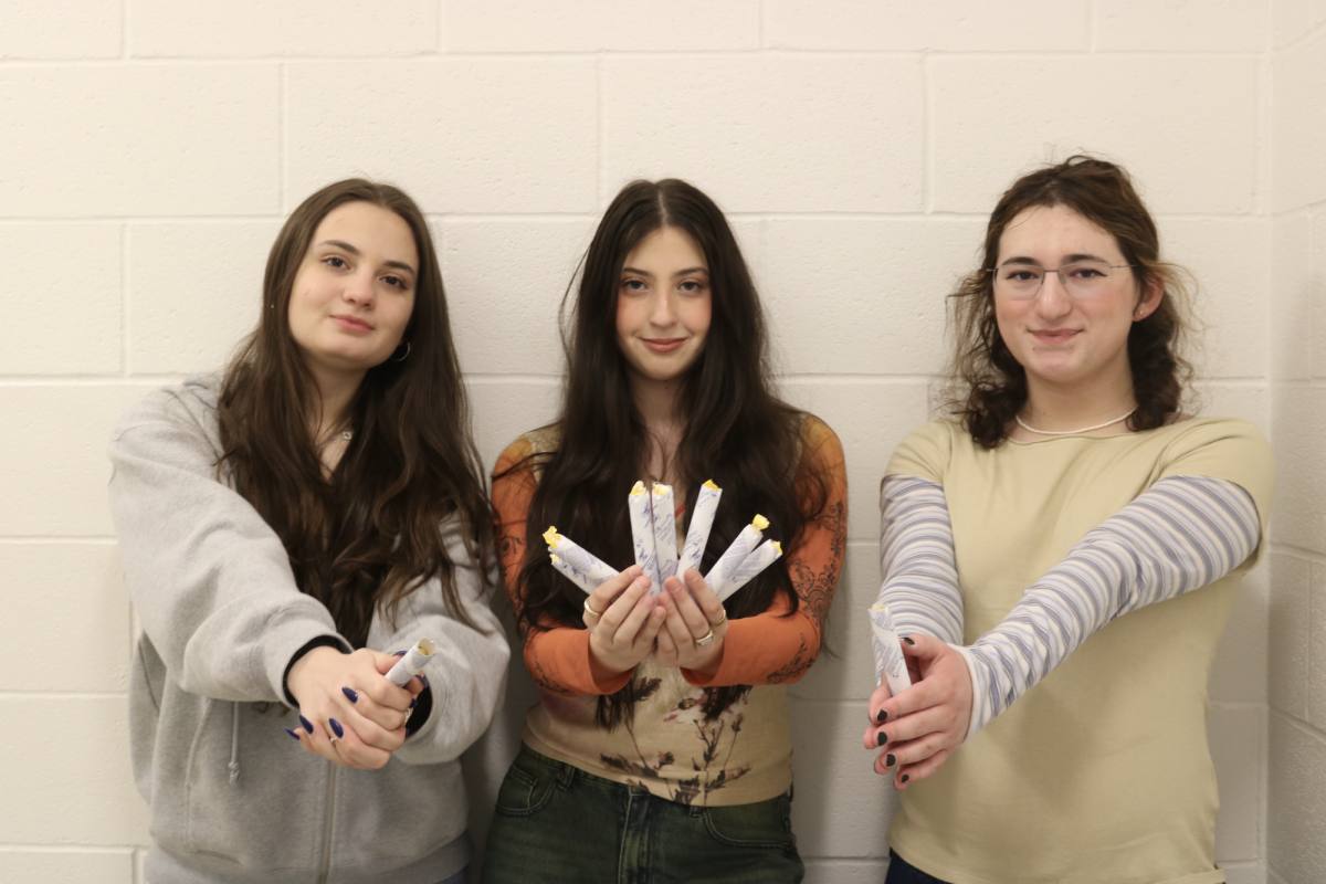 Three students, Melissa Pappas (left), Mia Lewis (center) and Jona Bernstein (right), took on the challenge of restocking tampons and pads in every female bathroom following the implementation of the Connecticut Menstrual Equity Act. 